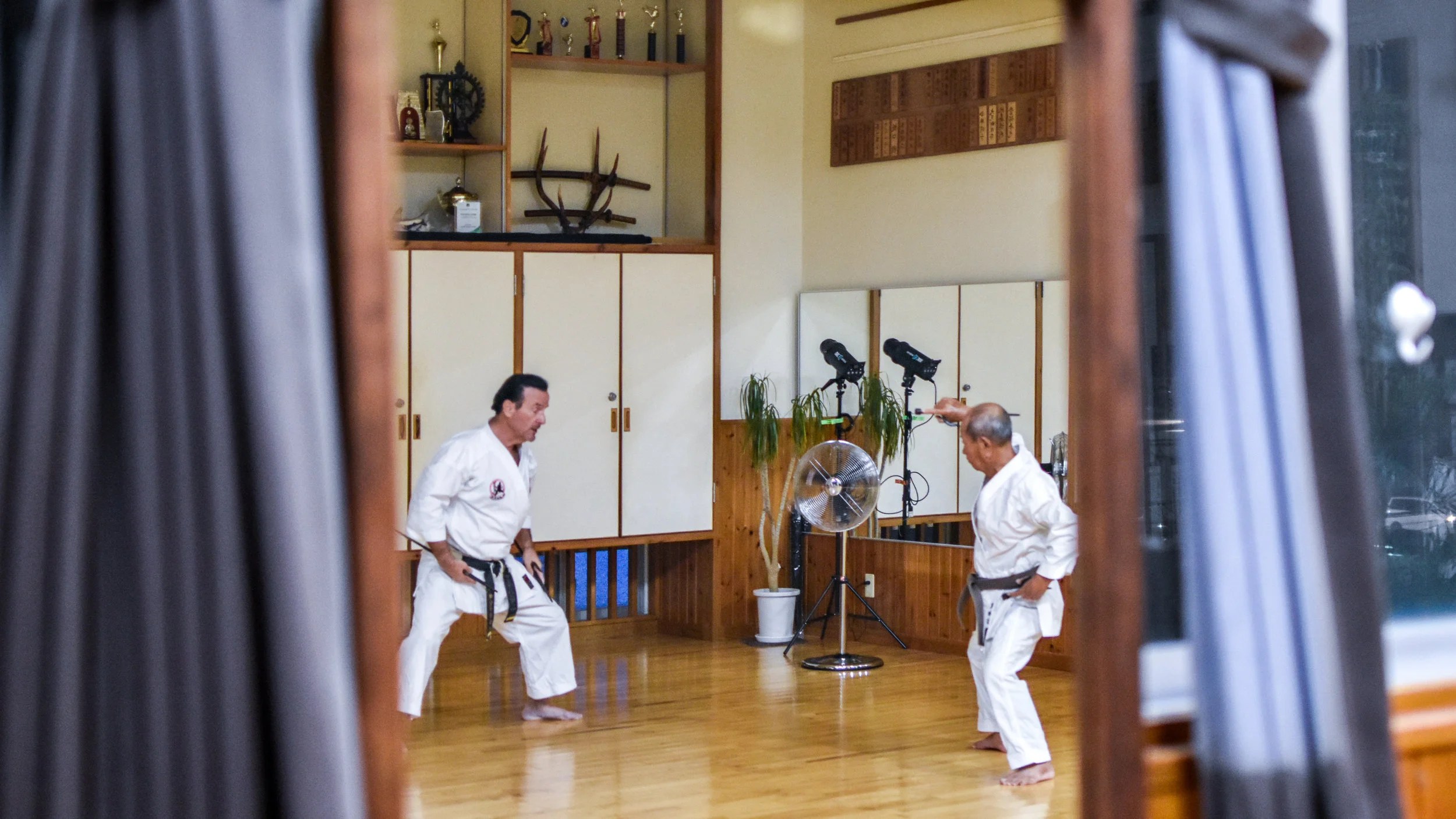 Dell Hamby Sensei takes one of the Shimbukan members through some Sai Kata